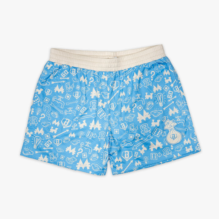 Youth model wearing youth shorts with “Grand Slam Collector” design