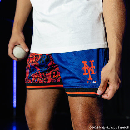 Adult model wearing blue shorts with "New York Mets Sticker Court" design