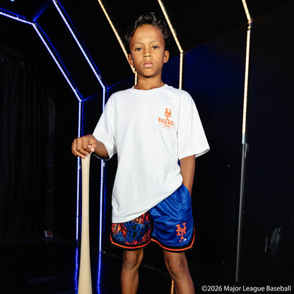 Youth model wearing blue youth shorts with "New York Mets Sticker Court" design