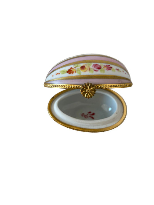 This item is a Dubarry Limoges porcelain egg-shaped trinket box